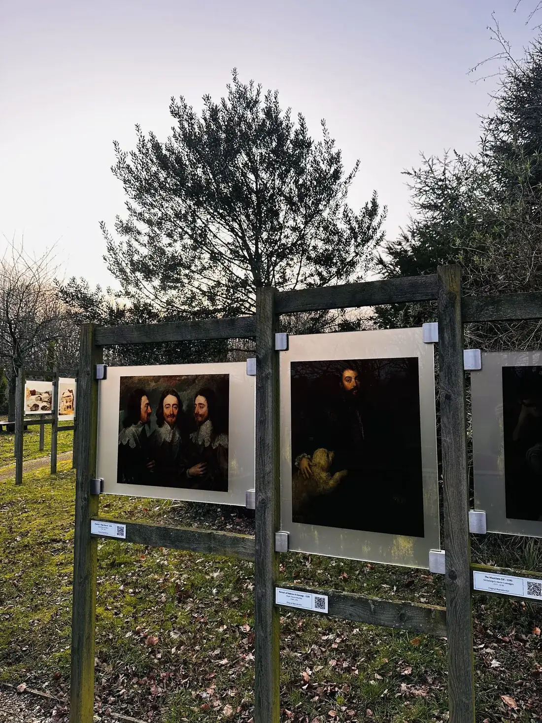 Outdoor art boards in the sunlit garden trail