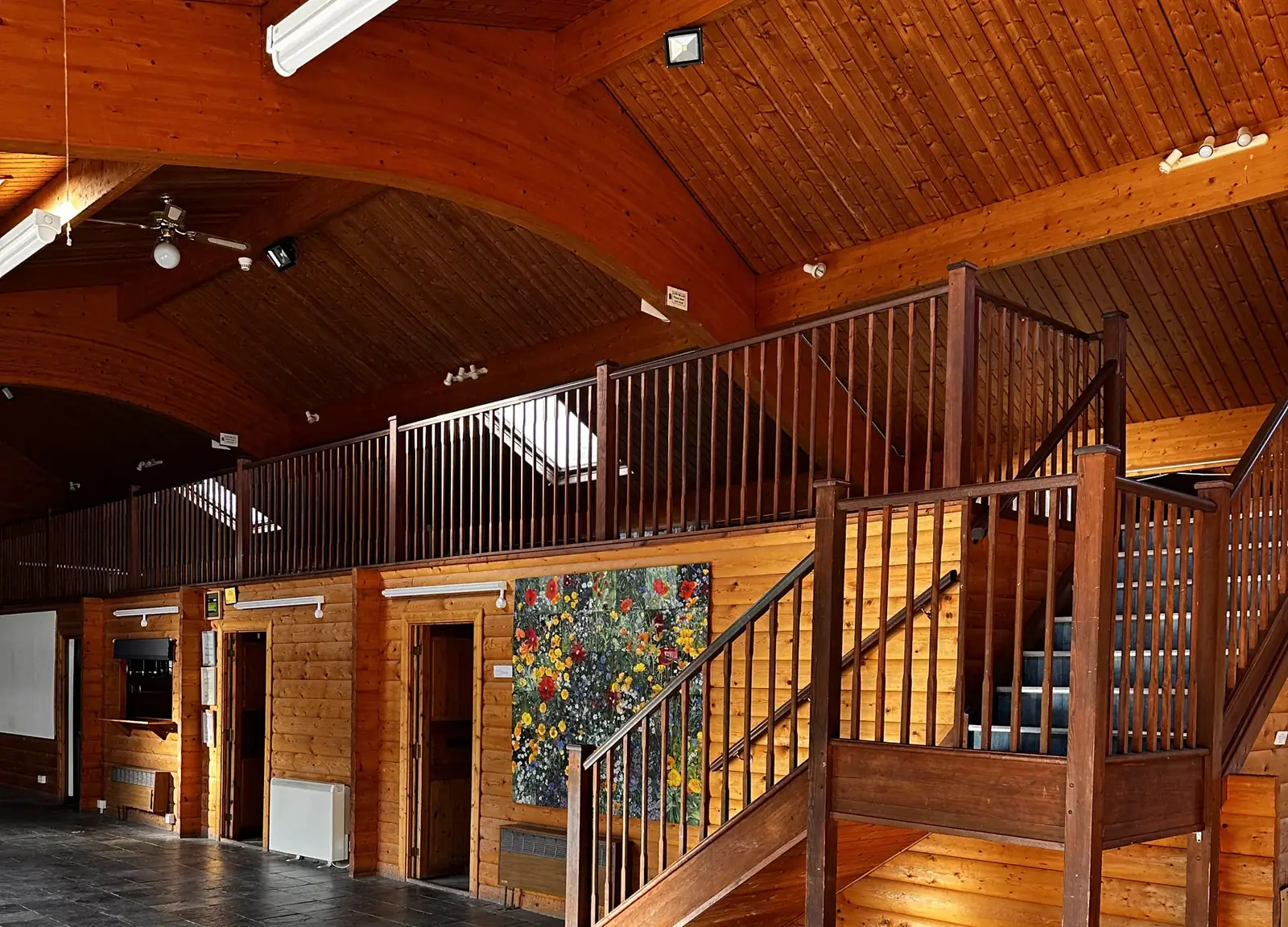 Timber-framed hall with slate floor and galleried staircase