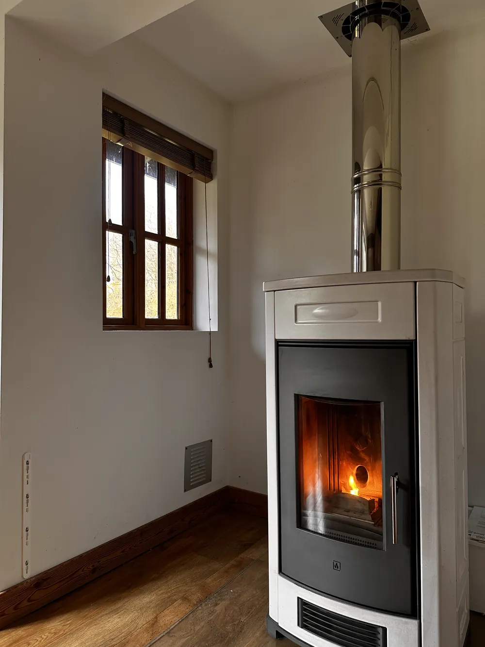 White stove with a glowing fire