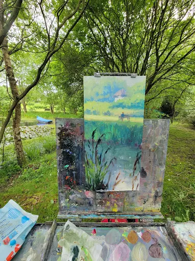 Plein-air painting of the pond on an easel