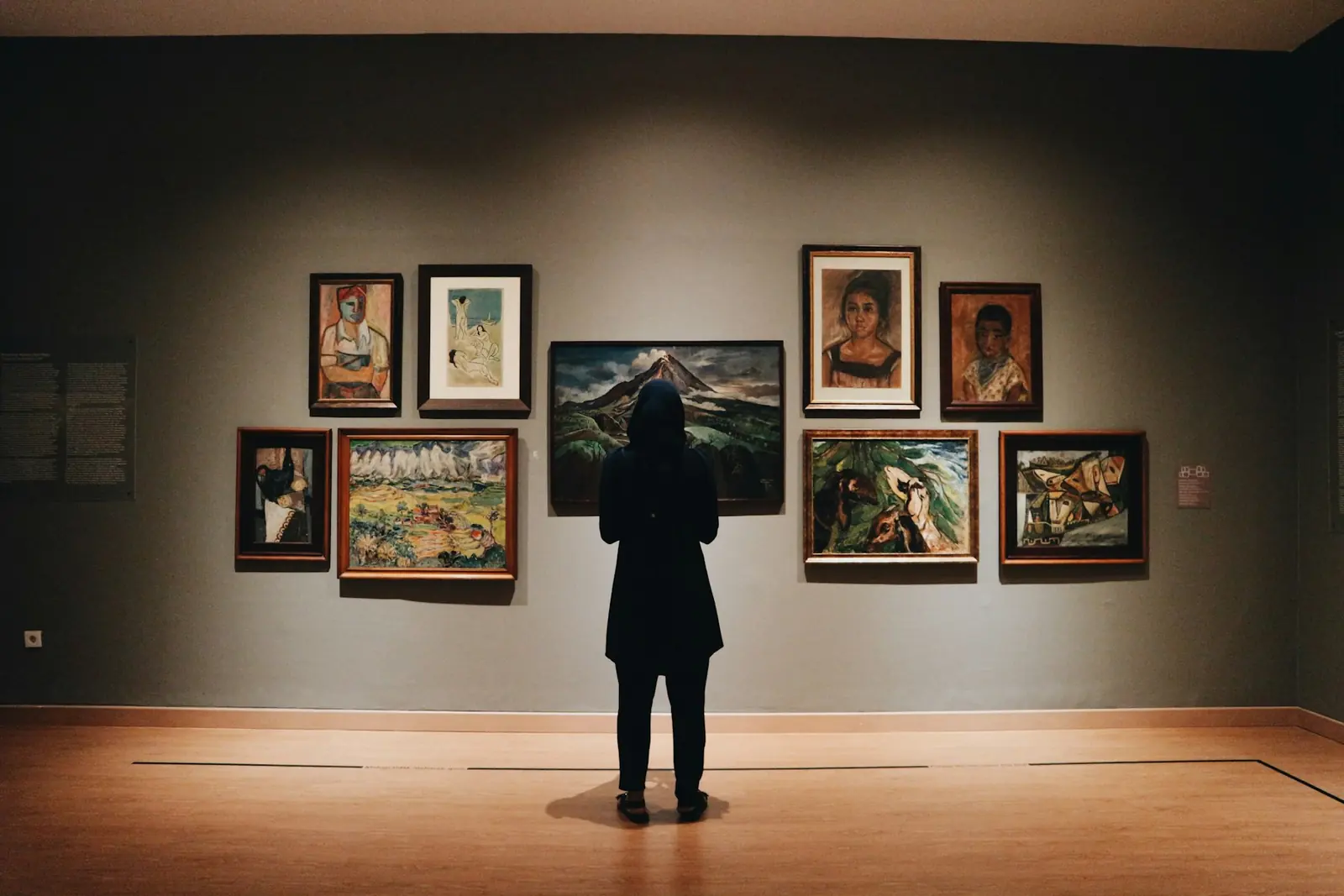 Framed paintings on a gallery wall