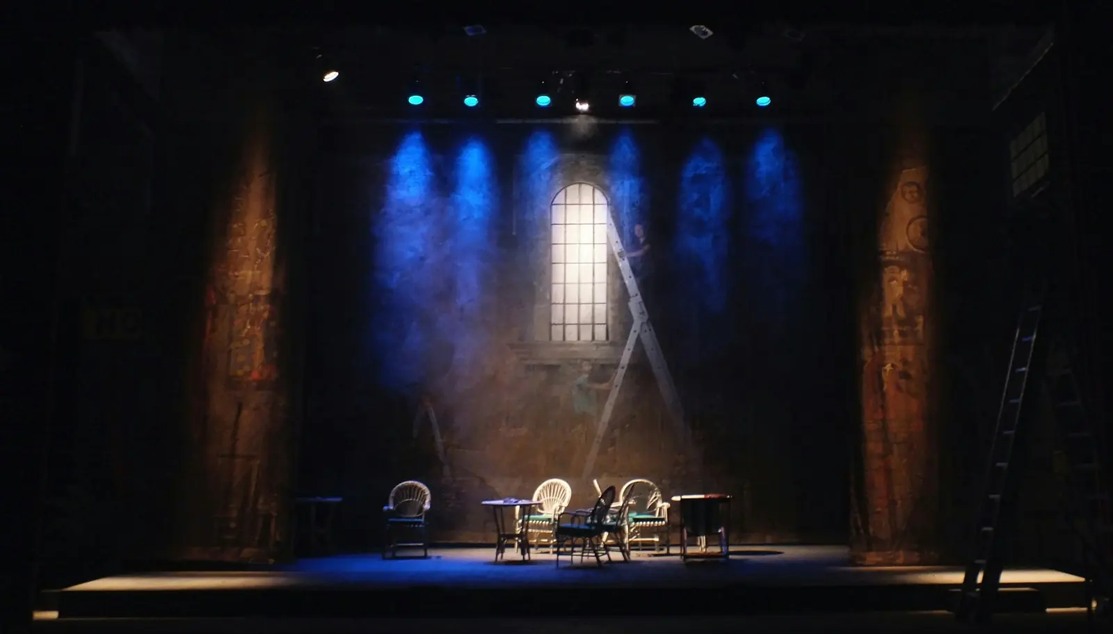 Stage lit by blue spotlights