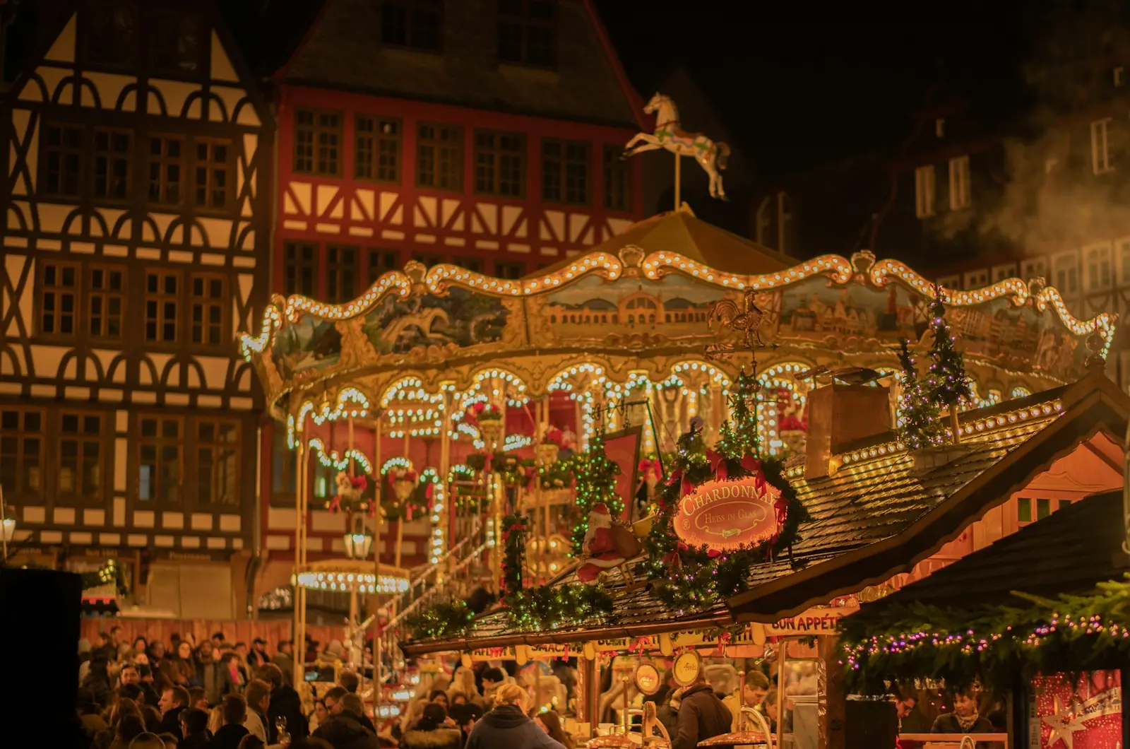 Illuminated carousel at a Christmas market